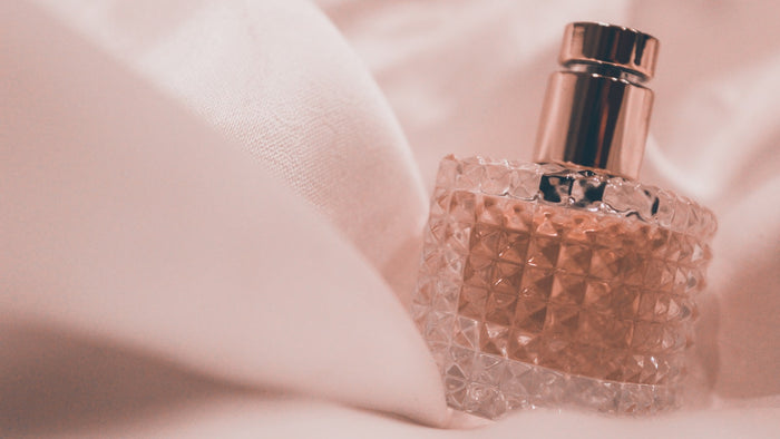 Faceted glass perfume bottle
