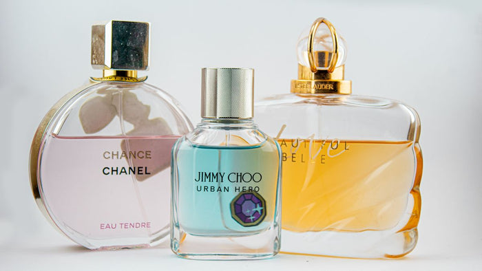 A lineup of designer perfume bottles in different concentrations