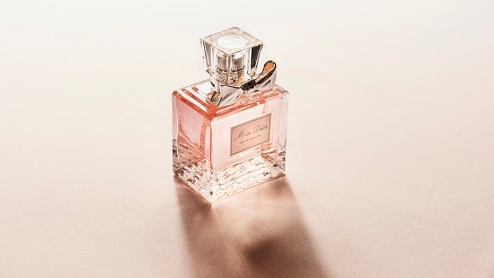Clear glass perfume bottle catching the light