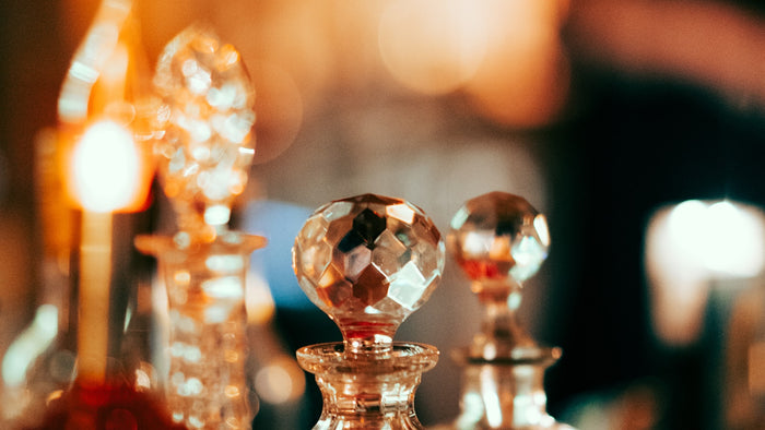 A row of glass fragrance bottles
