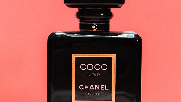 Black and gold perfume bottle, close up
