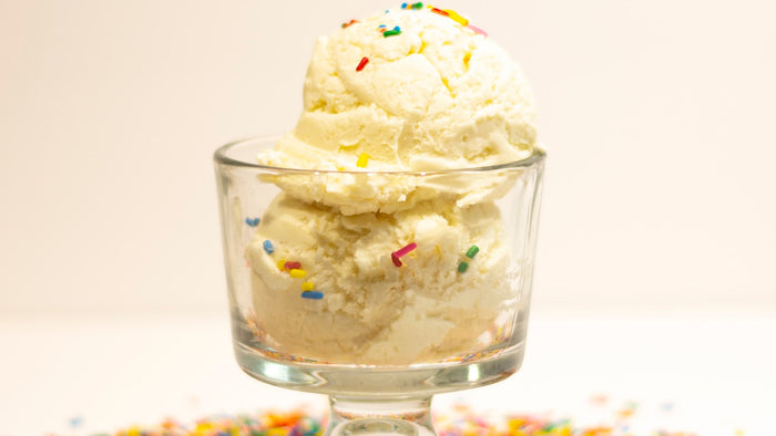 Creamy dessert with sprinkles, evoking gourmand sweetness